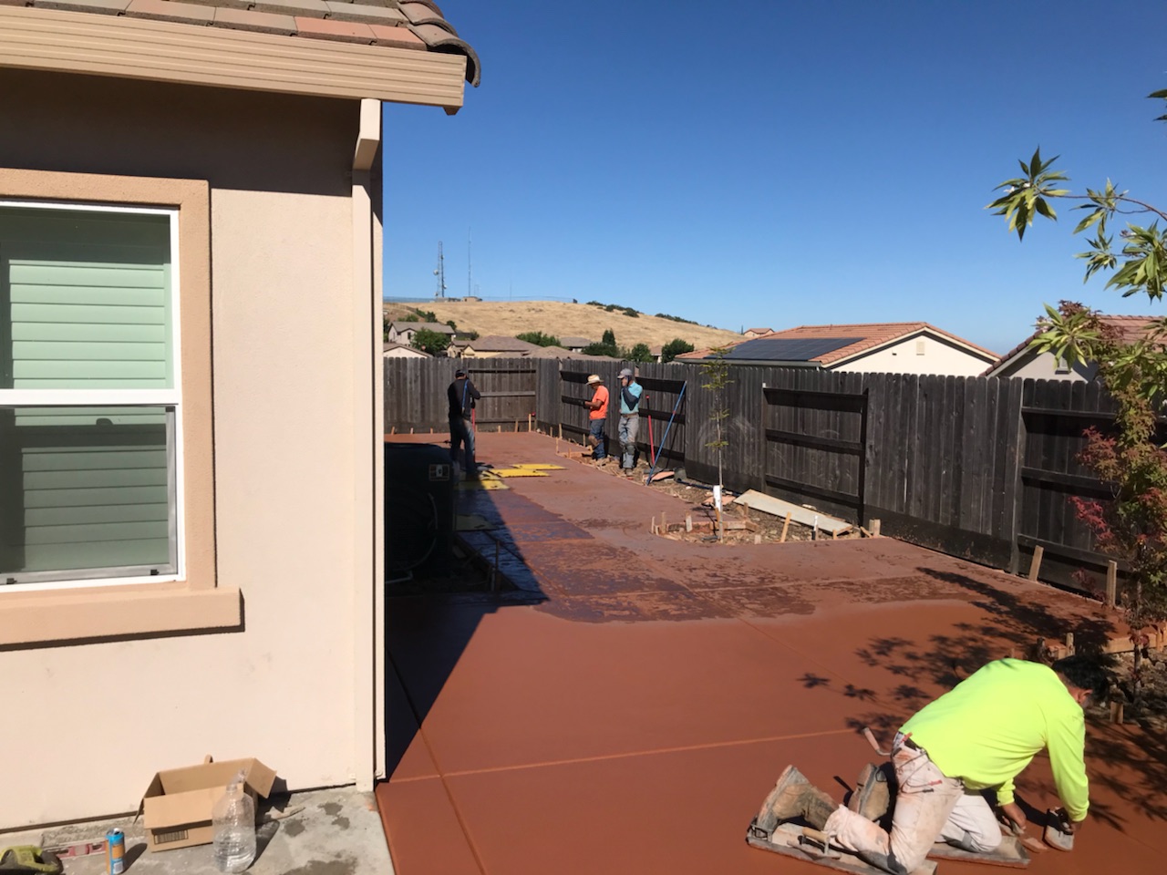 The photo shows the finished colored concrete work in Diamond Bar.